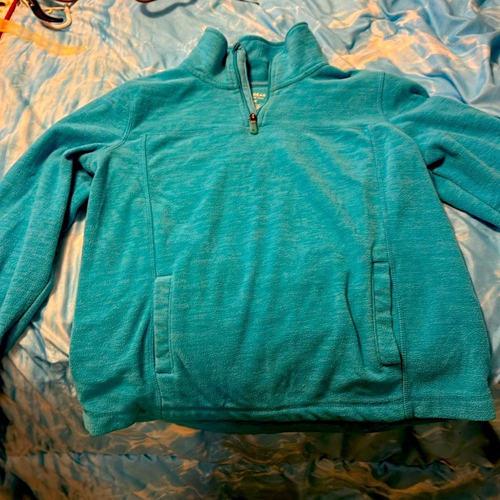Used, blue Tek gear sweatshirt with thumb holes and inside and outside pockets.